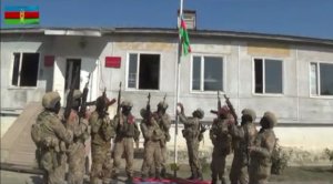 Azerbaijani flag raised up in center of liberated from occupation Fuzuli city